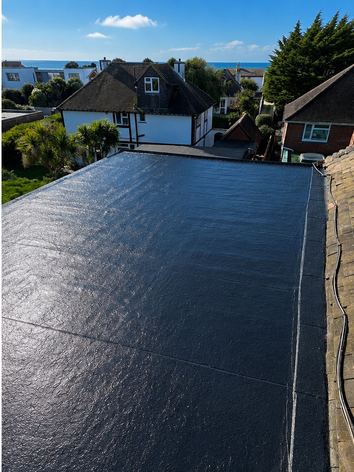 Completed flat roof with a fresh black waterproof covering