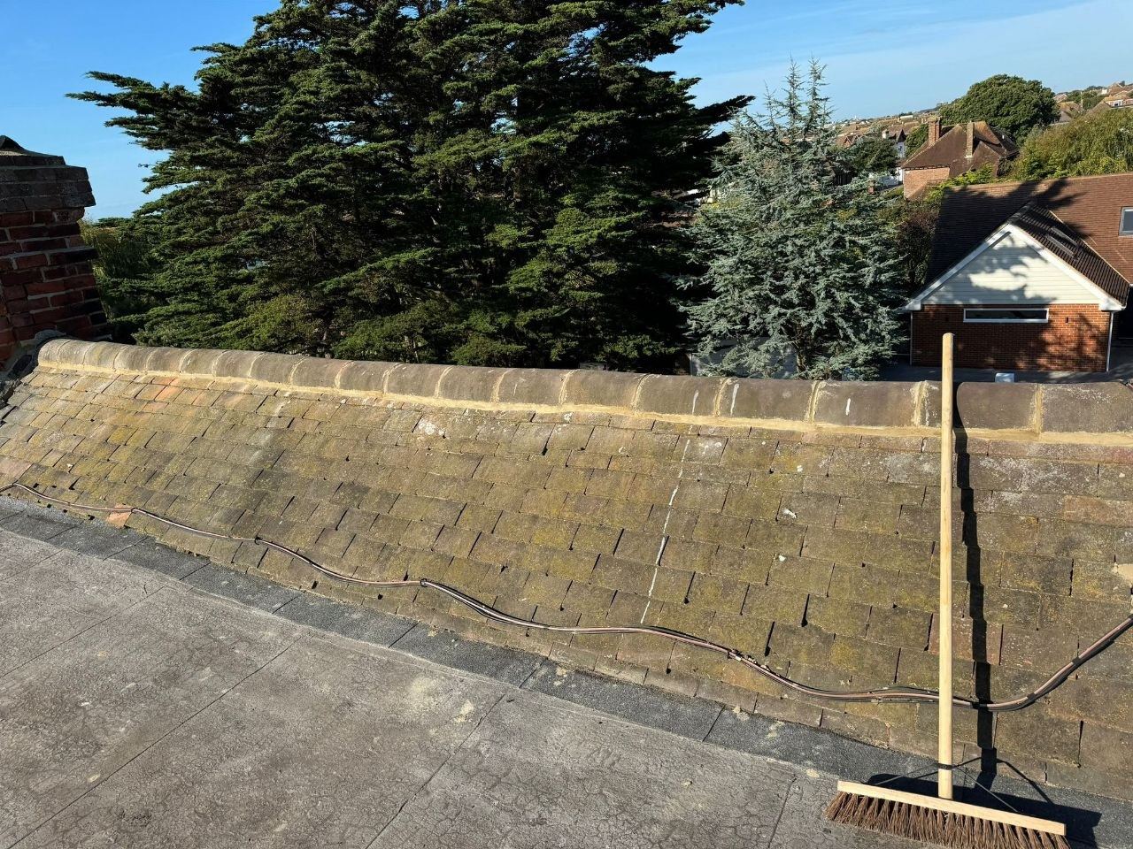 Roof slope part-covered during urgent weatherproofing work